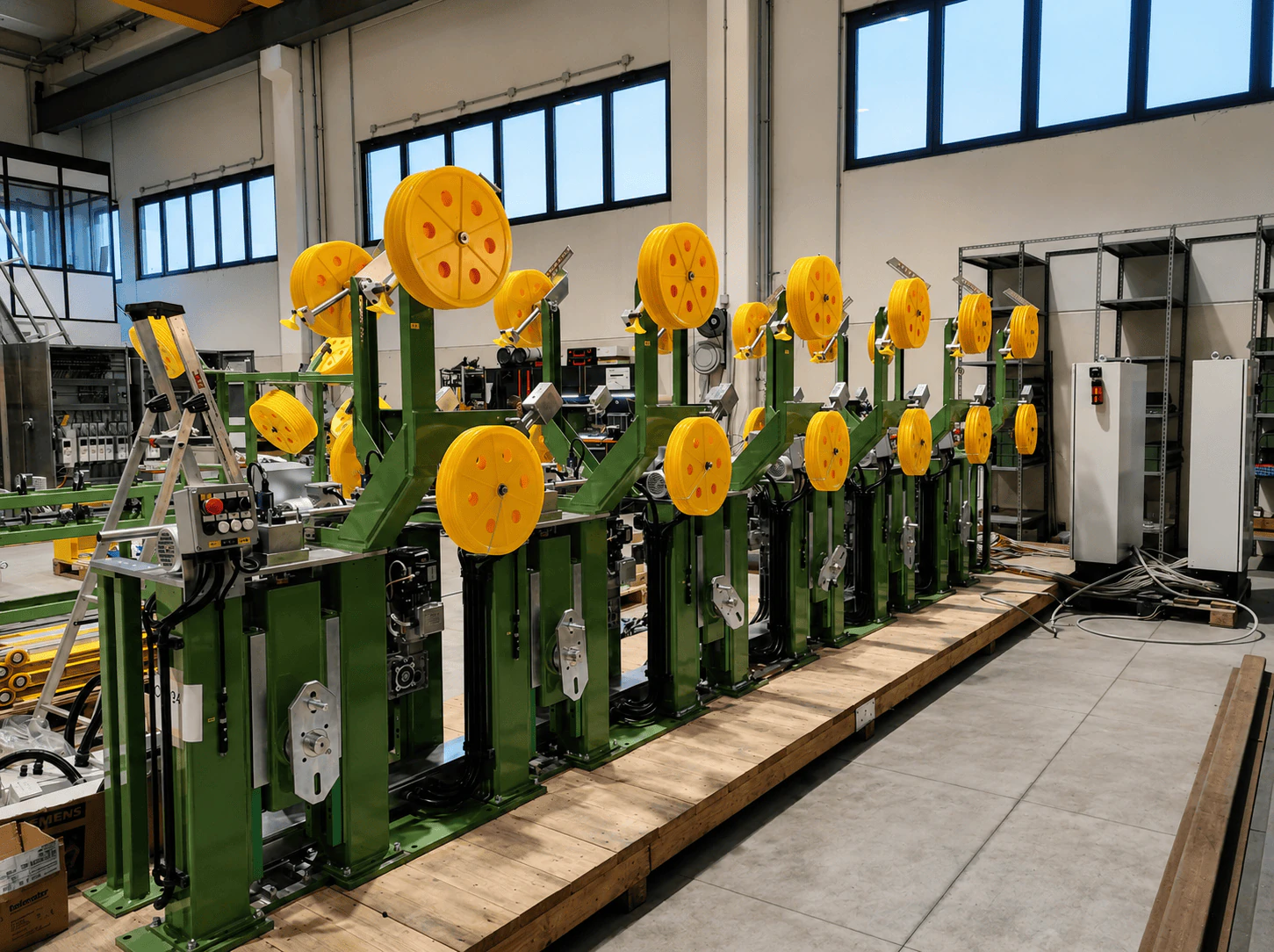 Overview of the tube line with reels, drive units, pushbutton station and integrated panel